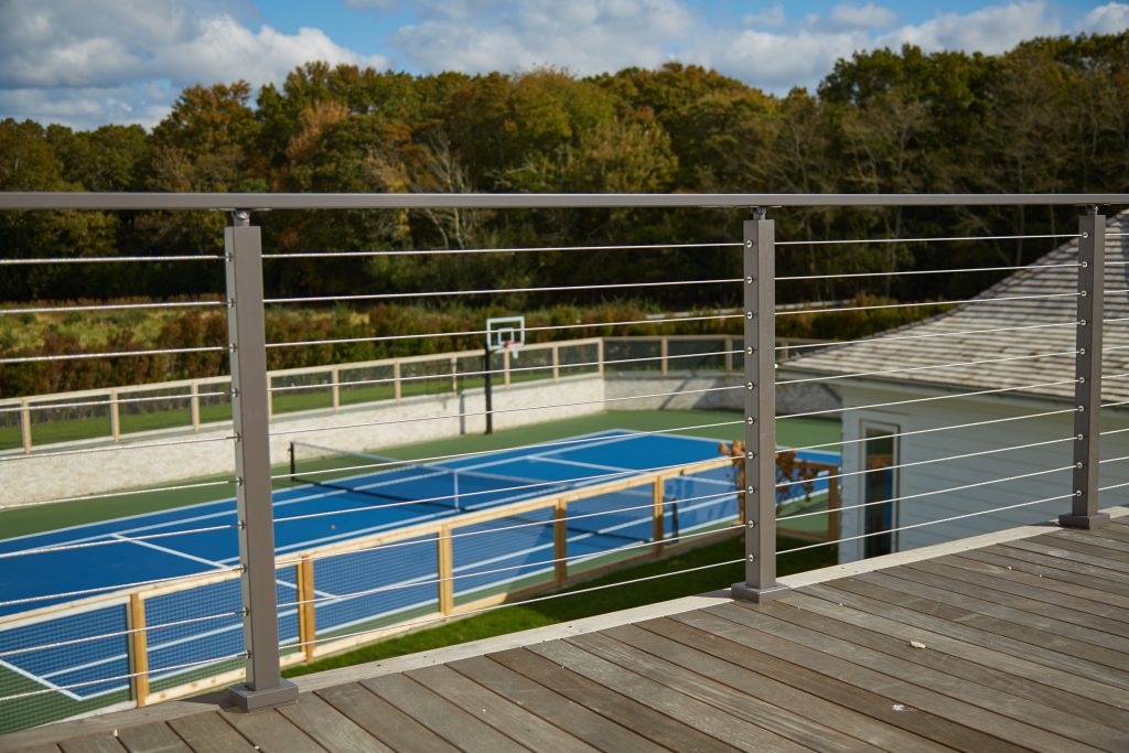 Grey Cable Railing posts and handrail on deck