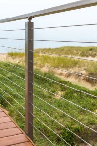 Aluminum posts and handrail cable railing system near beach