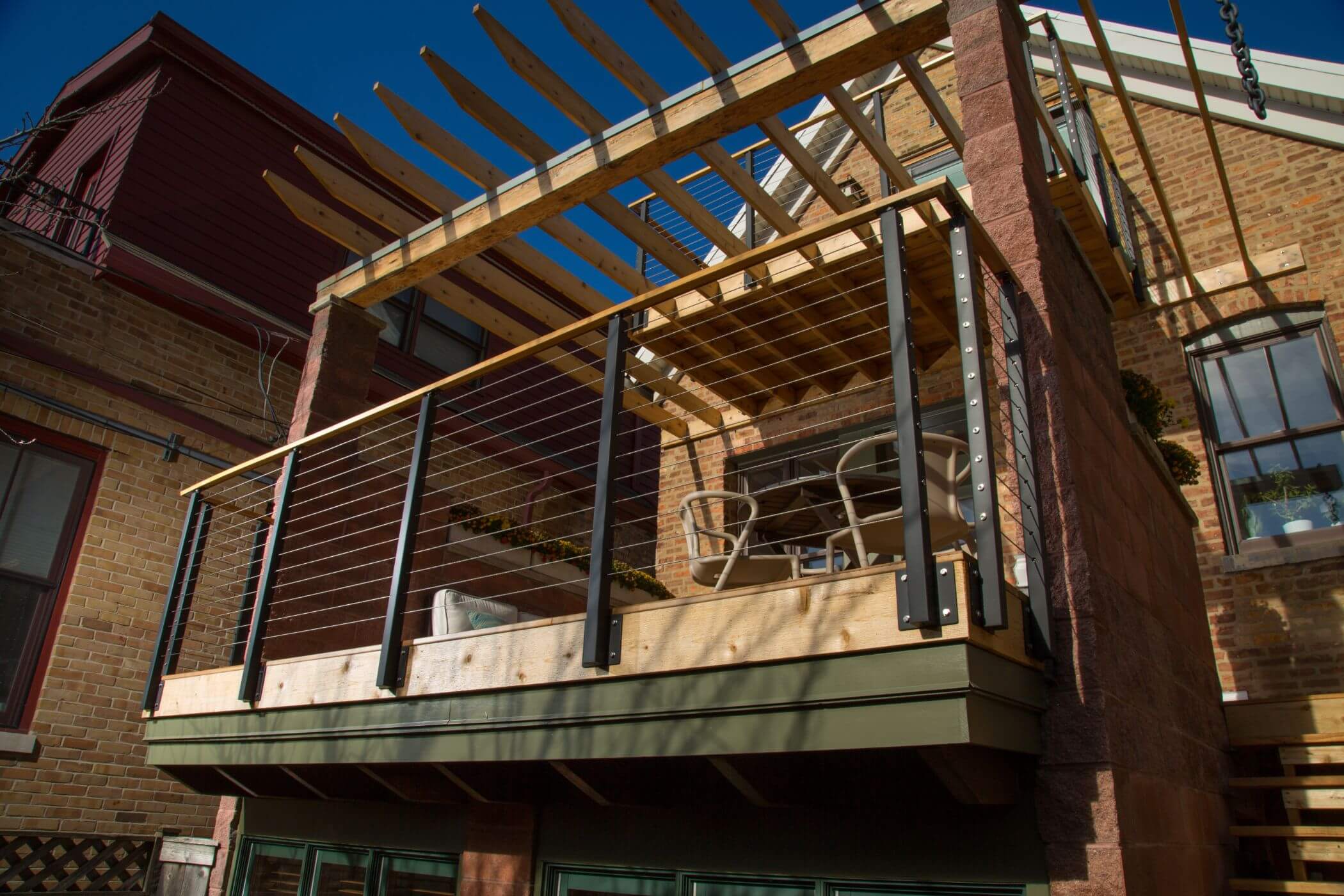 Pair Cable Patio Railing with a Pergola