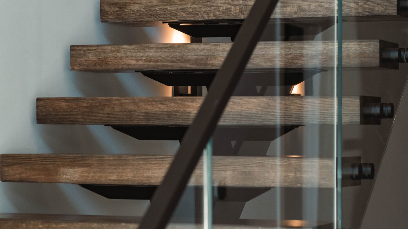 Dark Stained Wooden Stair Treads with Black Metal Stringer