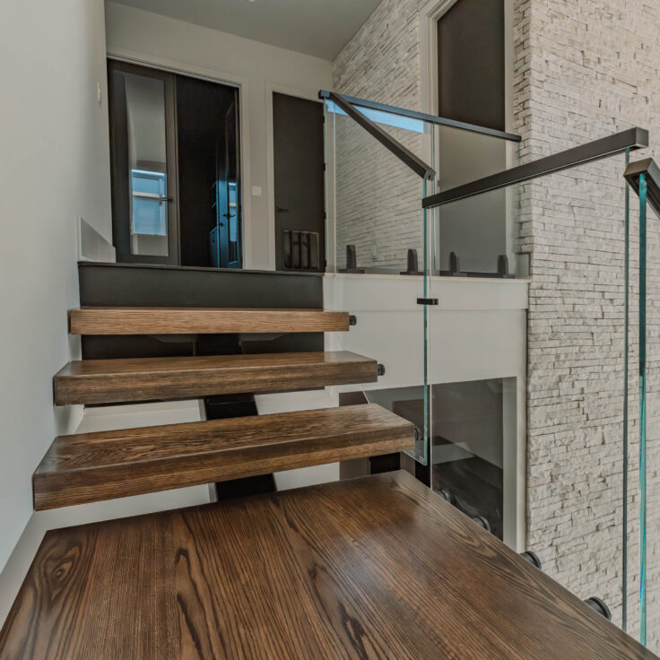 Dark Stained Wooden Stair Treads with Black Metal Stringer