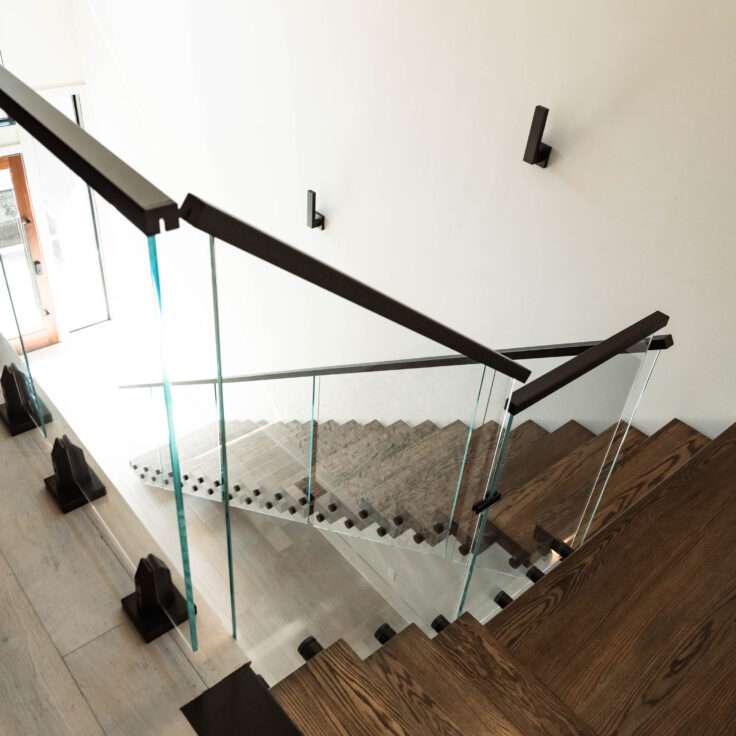 Dark Stained Wooden Stair Treads with Black Metal Stringer