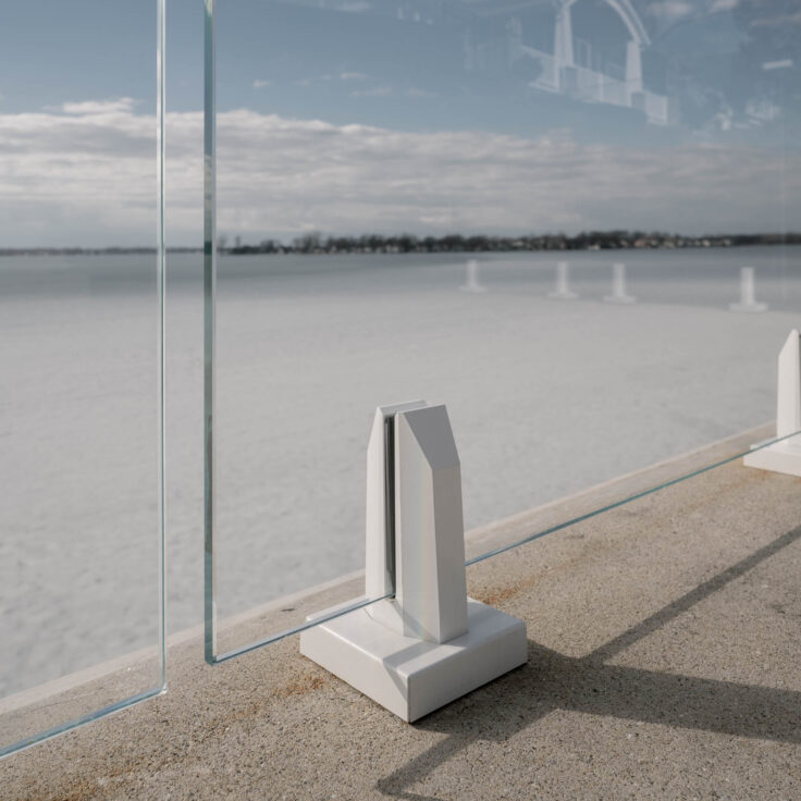 White Talon holds up a glass railing panel